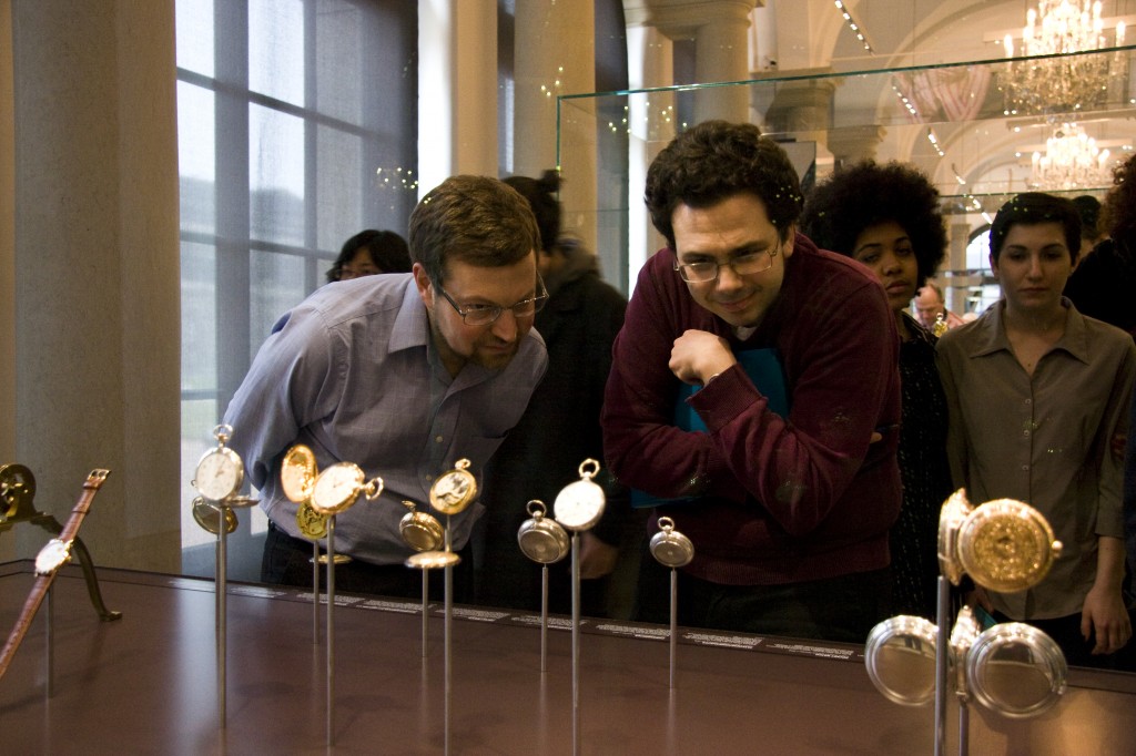 Professors Geoff Lehman and Michael Weinman captivated by a series of old pocket watches. (Photo by Inasa Bibić)