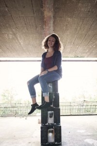 Flavia observing the world from atop a wall