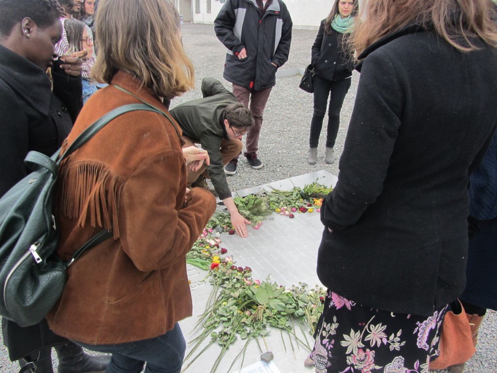 Students pay tribute to victims of one of Germany's largest concentration camps, Buchenwald.  This plaque, engraved with the names of the countless countries from which the fallen originated, rests at 37°C, human temperature. Almost every student reached down to touch what I felt was a hauntingly realistic representation of an immortal body.