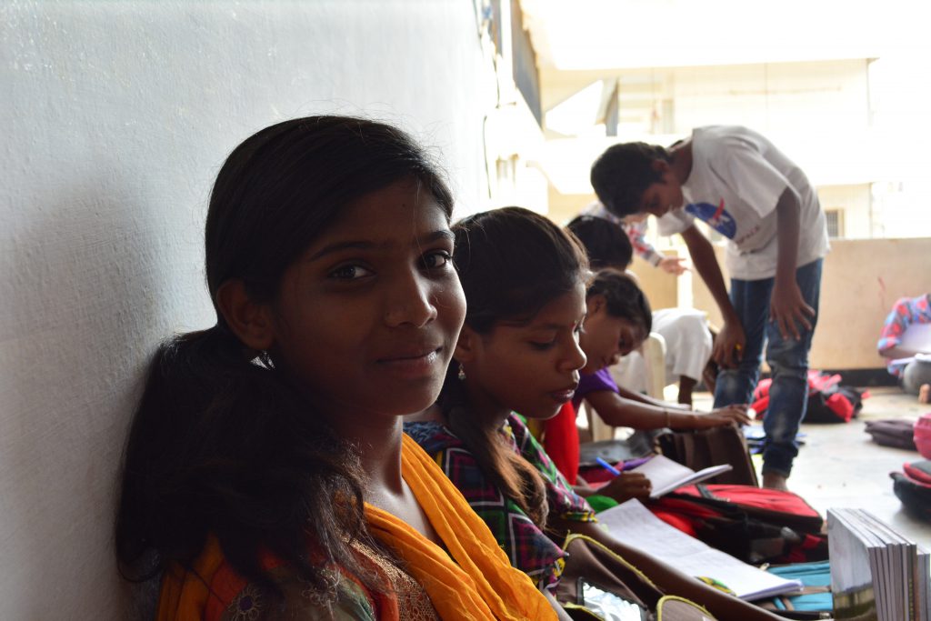 The children take half an hour between classes to finish their homework! (Credit: Tanya Sharma)