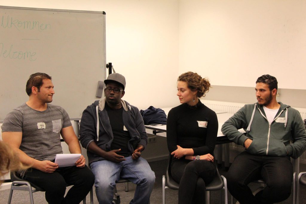 BCB student Clara Holder in discussion with other participants (Credit: Tamar Maare) 