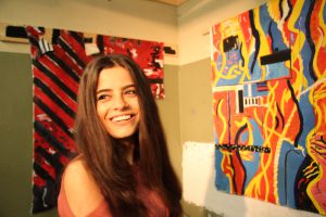 Wafa at a student artwork exhibition on campus (credit: Tamar Maare)